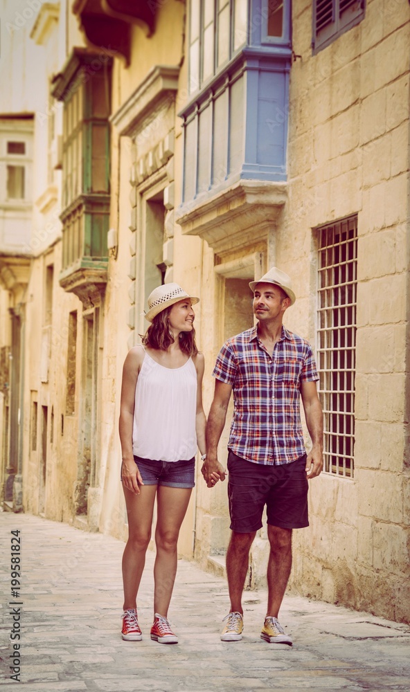 Young romantic couple tourists walking in Valletta, Malta