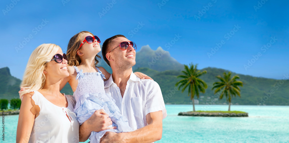 tourism, travel and family concept - happy mother, father and daughter over bora bora background tourism, travel and family concept - happy mother, father and daughter over bora bora background