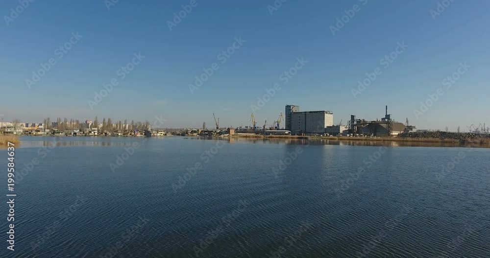 View top of fantastic landscape with a river port and a plant in morning haze, Central Europe View top of fantastic landscape with a river port and a plant in morning haze, Central Europe