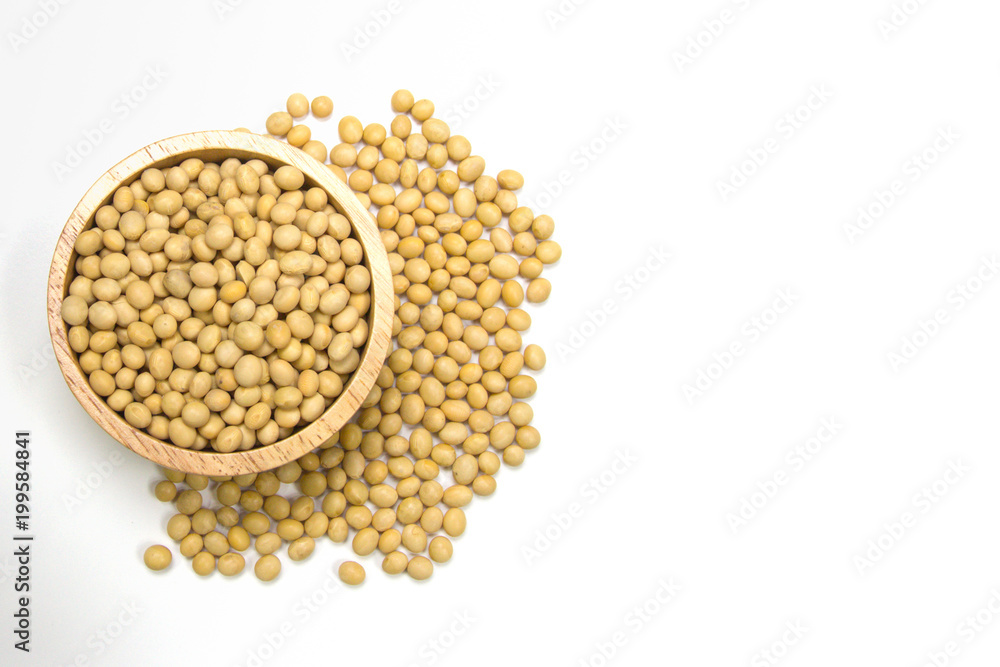 soybeans in the wooden bowl isolated on white background. Have a copy space for text. soybeans in the wooden bowl isolated on white background. Have a copy space for text.