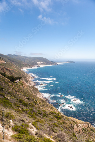 Rolling Hills and Waves Crashing on a Sandy California Beach