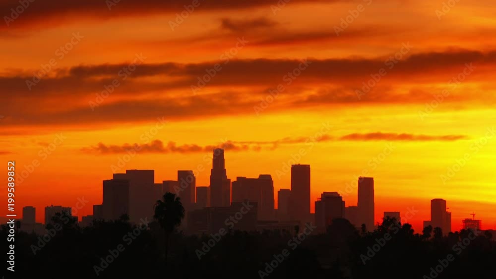 Time Lapse of the sun rising from behind the building of downtown Los Angeles. Time Lapse of the sun rising from behind the building of downtown Los Angeles.