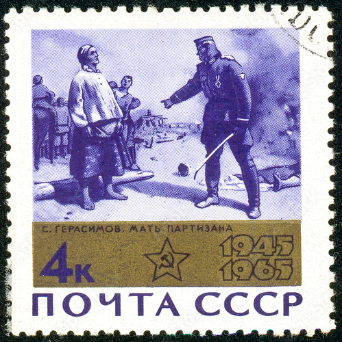 Ukraine - circa 2018: A postage stamp printed in USSR show painting Partisan Mother. Author Gerasimov. Series: 20th Anniversary of Victory in the Second World War. Circa 1965. photo