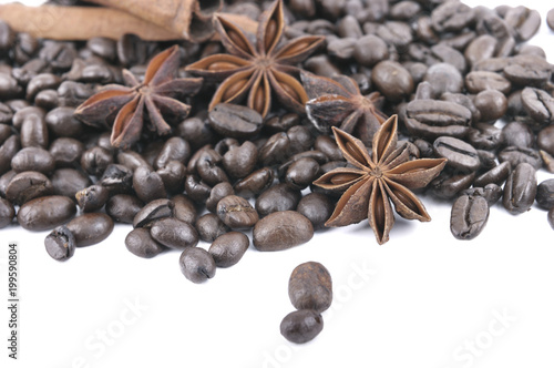anise and cinnamon in coffee beans heap  on white background
