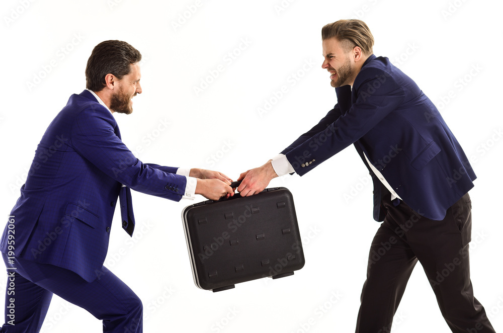 Two partners in tug of war concept with case Two partners in tug of war concept with case