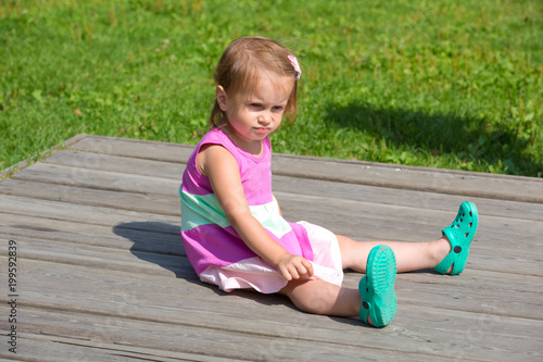 Cute little girl walking in the park