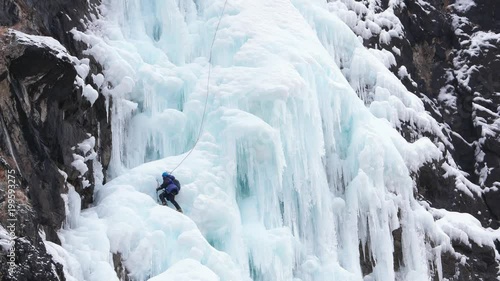 Wallpaper Mural Alpinist with belay climbs on icy wall Torontodigital.ca