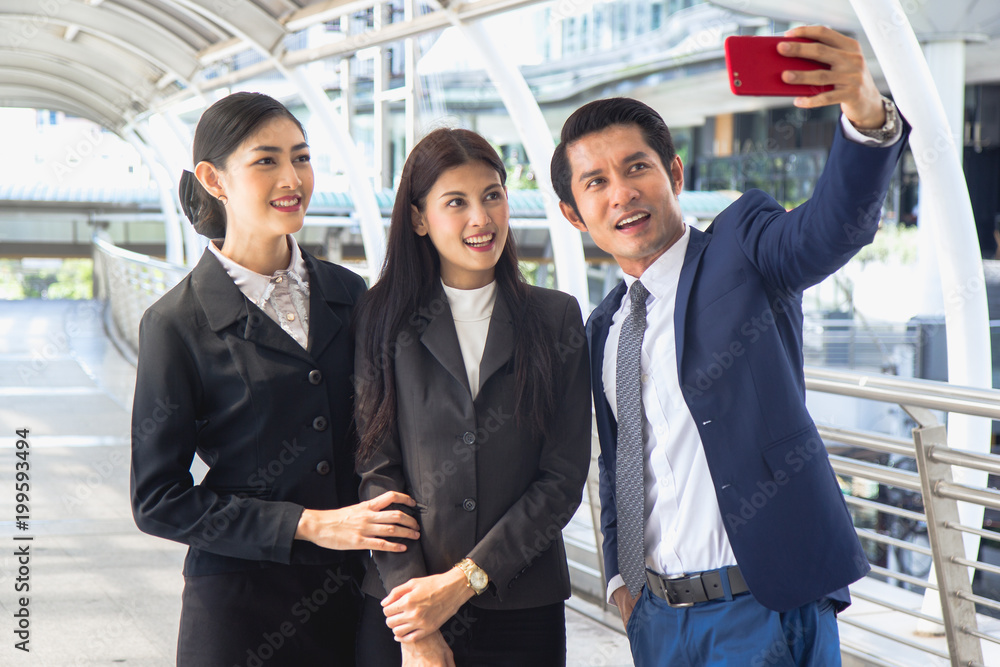 Teamwork colleagues in corporate concept. Group of businesspeople taking selfie shot after finish seminar. Teamwork colleagues in corporate concept. Group of businesspeople taking selfie shot after finish seminar.