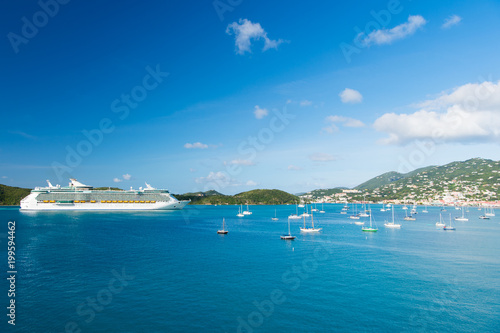 St.Thomas, British virgin island cruise ship and yachts at seaside. Ocean liner in blue sea on sunny sky. Water transport and vessel. Travel by sea, wanderlust. Vacation on island