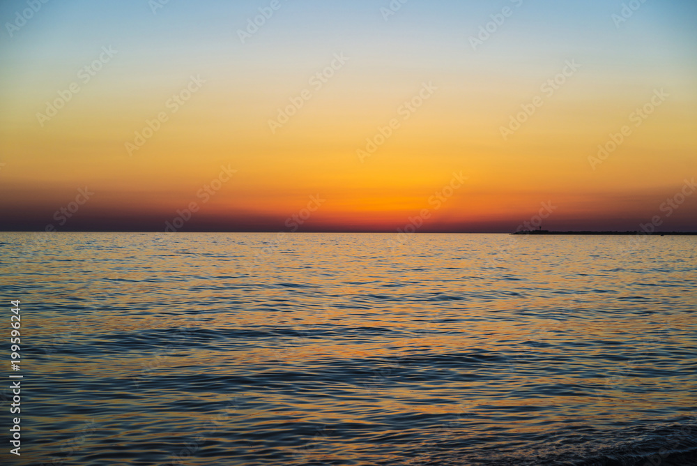 Sunset over the Mediterranean sea in summer in Sicily, Italy