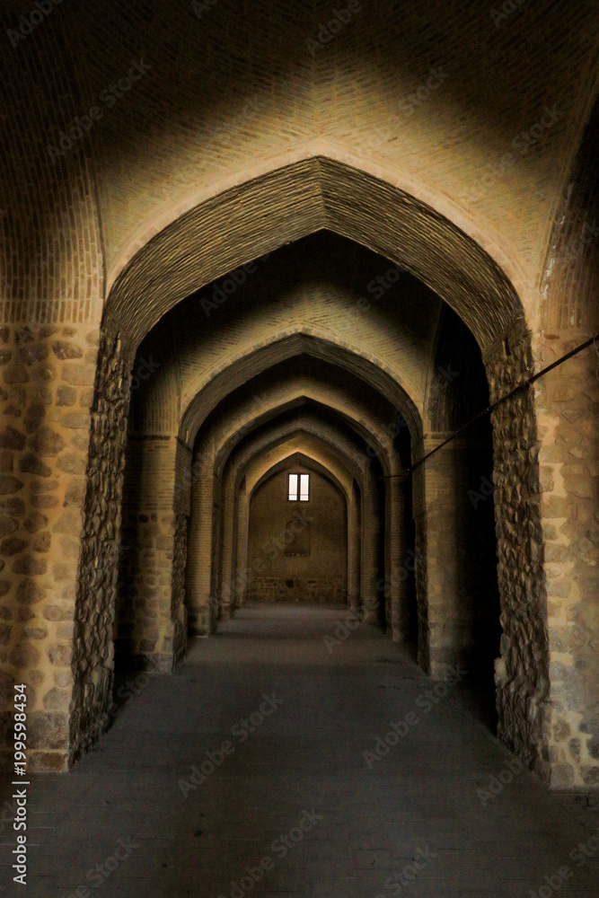 Fototapeta premium Dark corridor, arch in the building