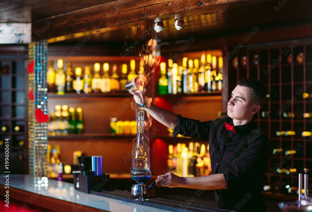 Bartender makes hot cocktail.