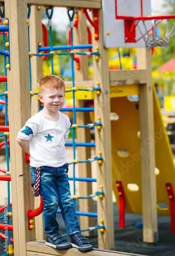 Little boy playing on the playground.