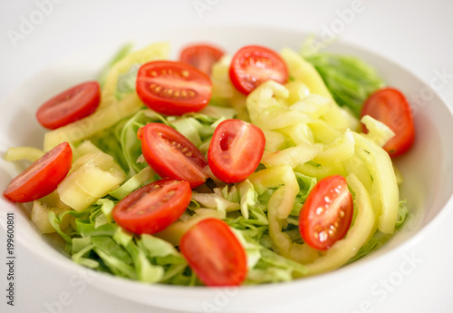 Dish with vegetable salad, tomato