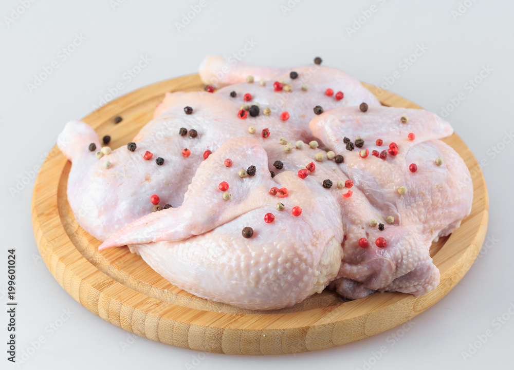 raw chicken carcass on the cutting board isolated on white background raw chicken carcass on the cutting board isolated on white background