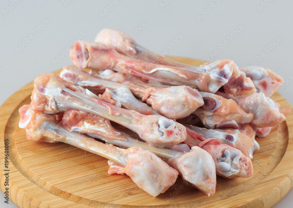  raw chicken bones on white background