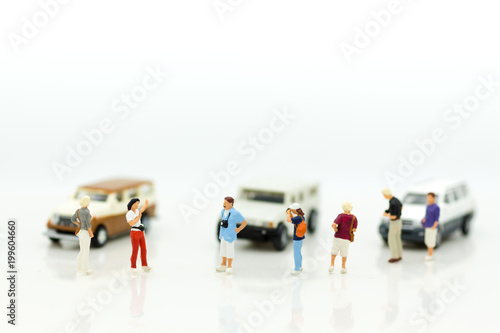 Miniature people : Businessman standing with car. Image use for Advertising product in the market today, competition on the business trading.