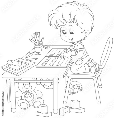 Little boy doing his homewo...