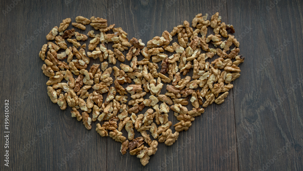peeled walnuts on the table ,heart, top view peeled walnuts on the table ,heart, top view