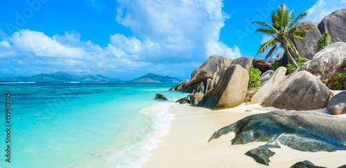 Source d'Argent Beach at island La Digue, Seychelles - Beautifully shaped granite boulders and rock formation - Paradise beach and tropical destination for vacation photo