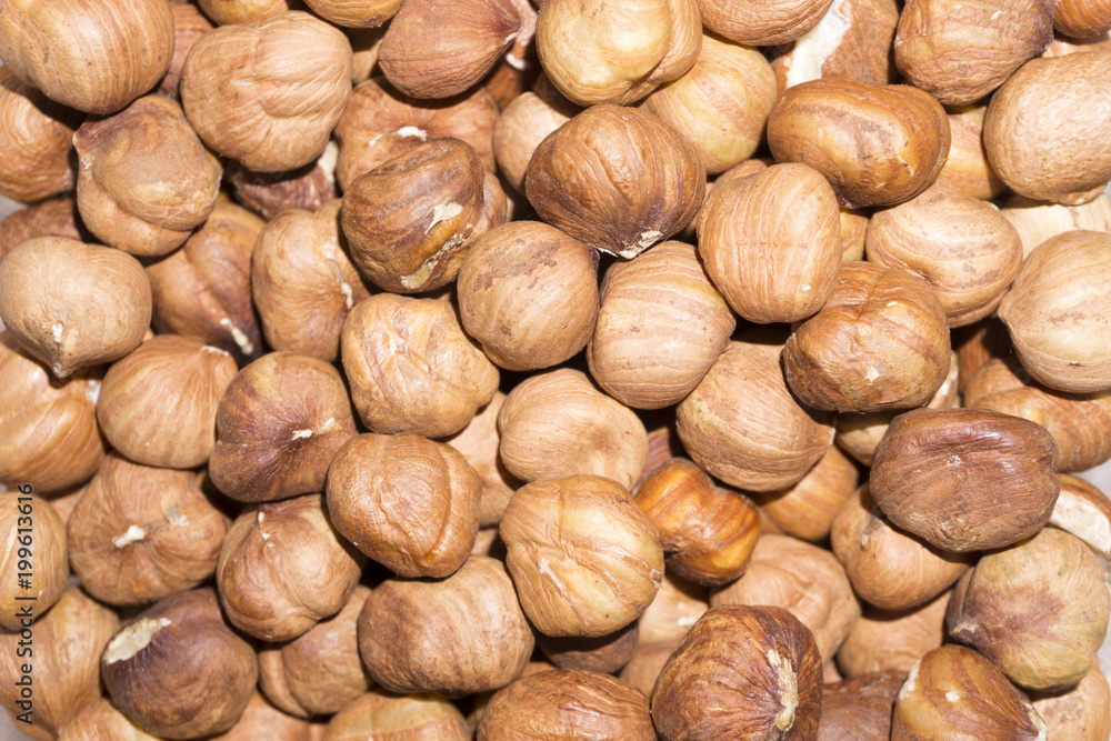 background - peeled ripe hazelnut kernels closeup background - peeled ripe hazelnut kernels closeup