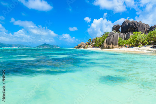 Source d'Argent Beach at island La Digue, Seychelles - Beautifully shaped granite boulders and rock formation - Paradise beach and tropical destination for vacation photo