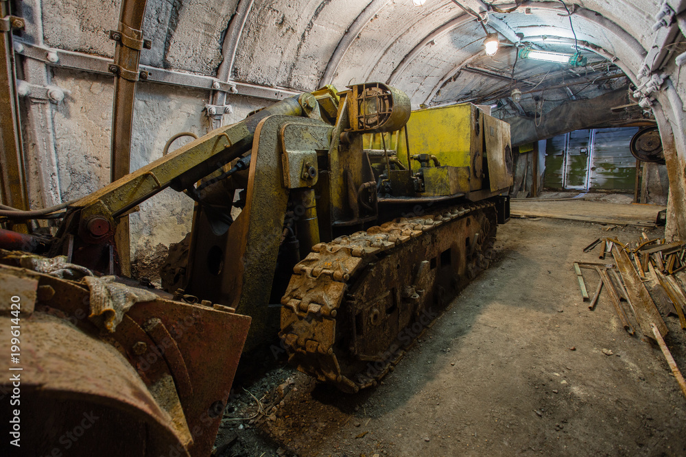 Underground coal ore mine shaft tunnel gallery with harvester coal combine miner Underground coal ore mine shaft tunnel gallery with harvester coal combine miner