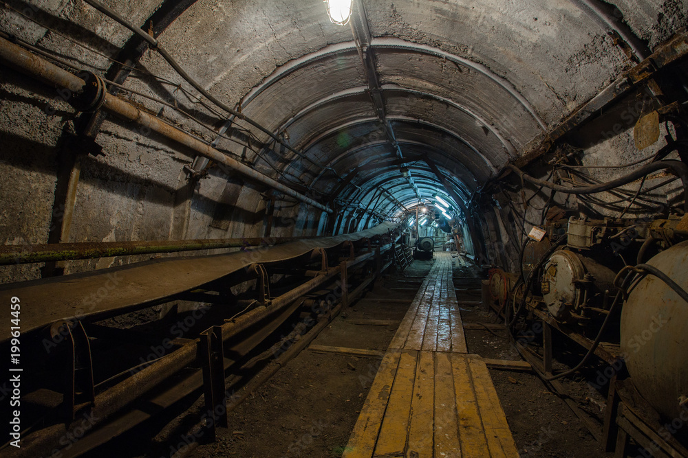 Underground coal ore mine shaft tunnel gallery with transporter conveyor
