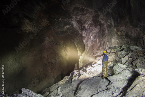 Underground ore gold mine tunnel drift with huge cavern cavity