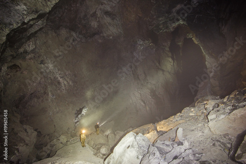 Underground ore gold mine tunnel drift with huge cavern cavity