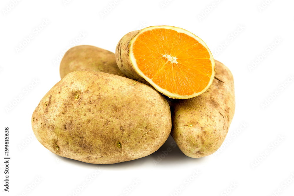 Eat your veggies! a sliced potato reveals the flesh of a fresh Orange