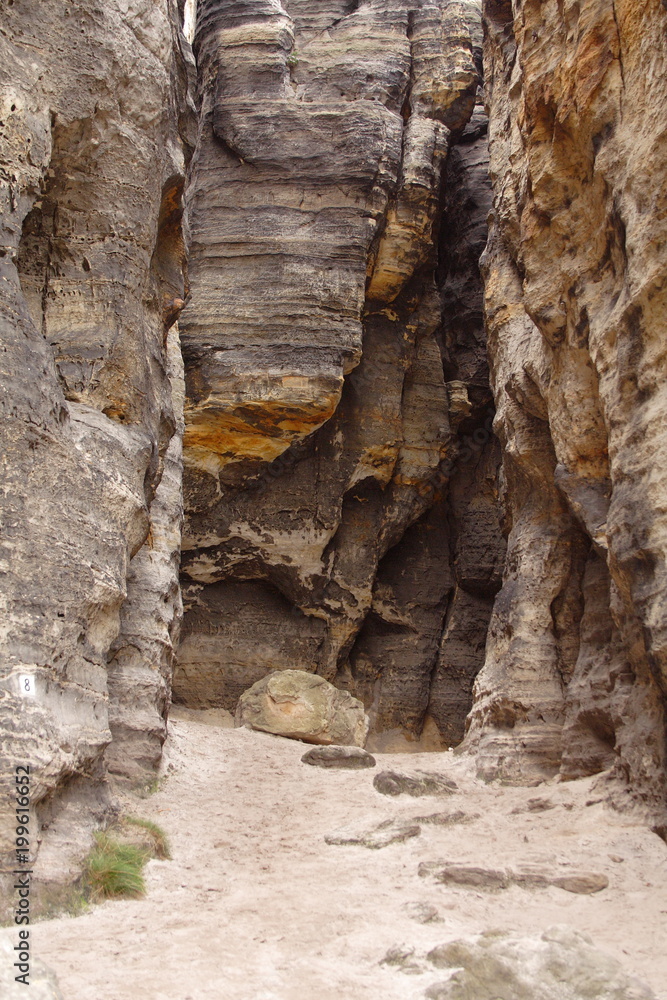 Obraz premium High stone walls surround opening.