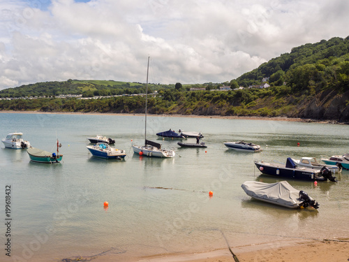 Pleasure craft moored in the harbour on a summers day at New Quay, Credigon, Wales, UK photo