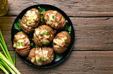 Baked potatoes with bacon, green onion and cheese