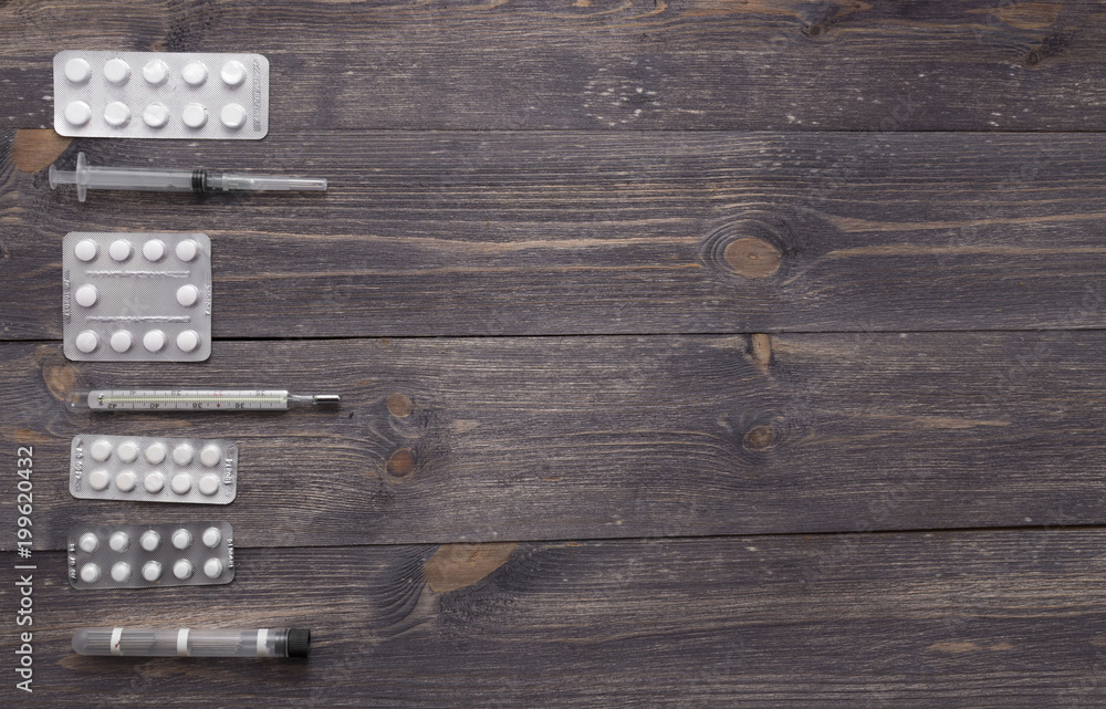 Pharmaceutical medicine pills, tablets and on wooden background for health, top view, flat lay, copy space Pharmaceutical medicine pills, tablets and on wooden background for health, top view, flat lay, copy space