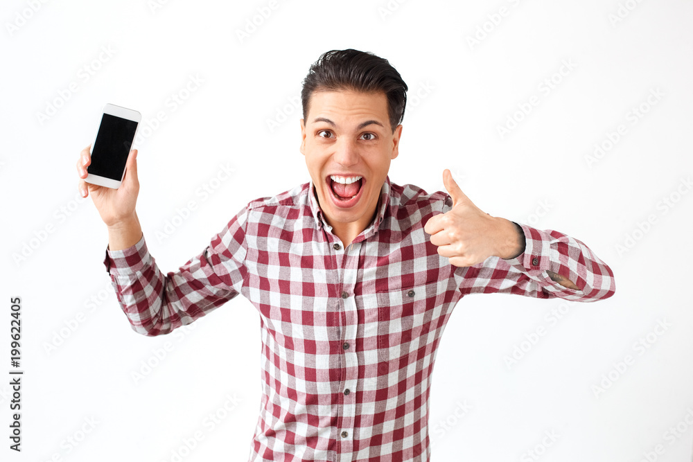 Man toothy smiling and showing like sign, thumbs up