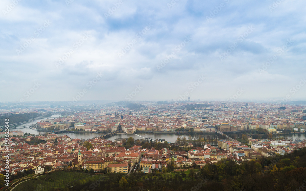 Panoramic view of Charles Bridge and other bridges over Vltava river and Old city from Petrin hill Observation Tower. Prague, Czech Republic, autumn cityscape