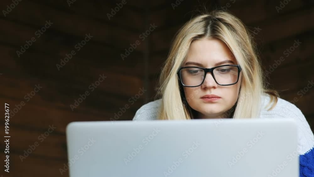 portrait of sleepy young tired woman with stylish glasses using notebook and yawning funny expression of face gesture modern laptop freelance business internet surfing online working hard overtime portrait of sleepy young tired woman with stylish glasses using notebook and yawning funny expression of face gesture modern laptop freelance business internet surfing online working hard overtime