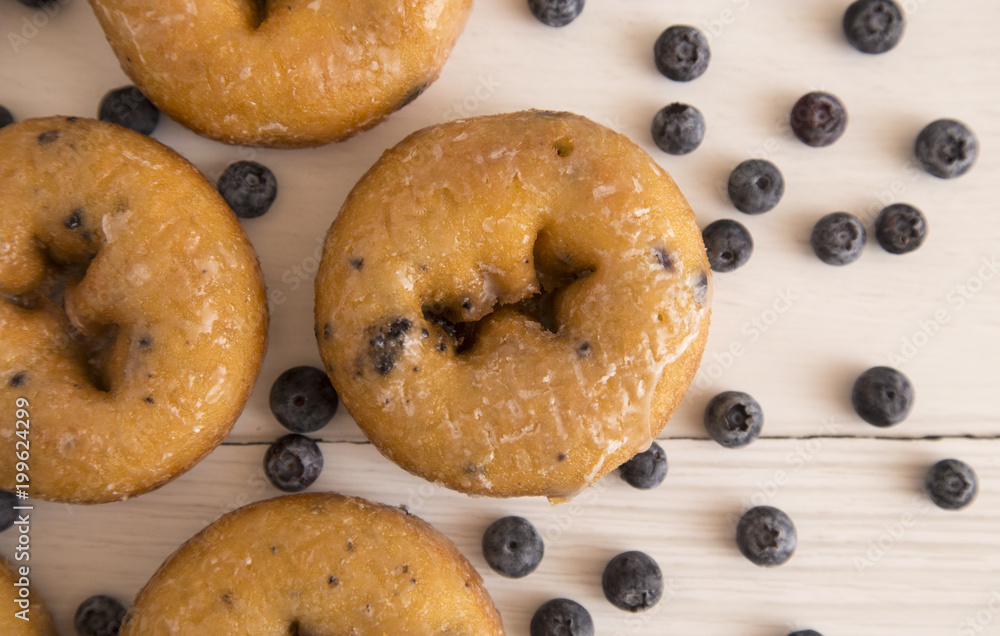 Blueberry Cake Donuts on a White Wooden Table
