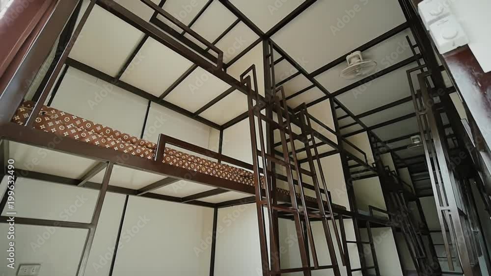 Three-story beds in a budget Asian hostel. Three-story beds in a budget Asian hostel.