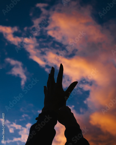 hands and sky