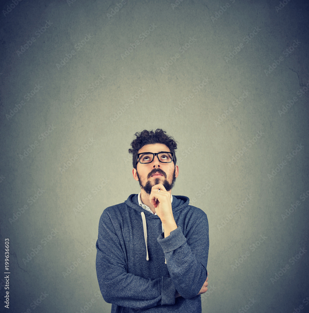 handsome hipster young man thinking handsome hipster young man thinking