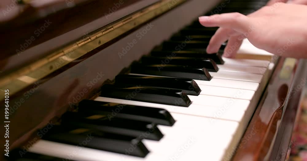 Man playing piano at home