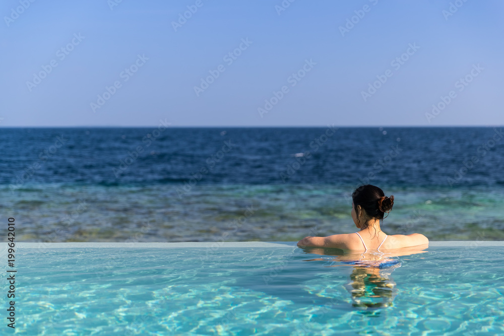 Outdoor swimmimg pool and blue sea