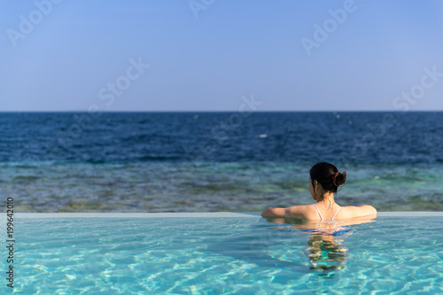 Outdoor swimmimg pool and blue sea