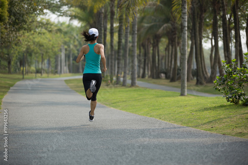 sporty fitness woman running at park