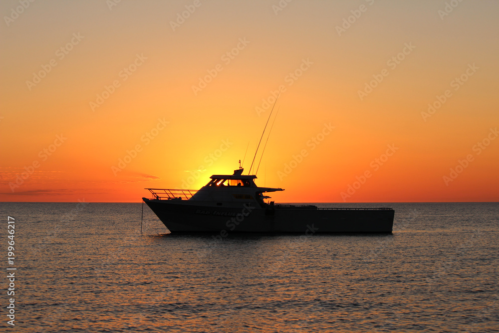 Sunset fishing boat 