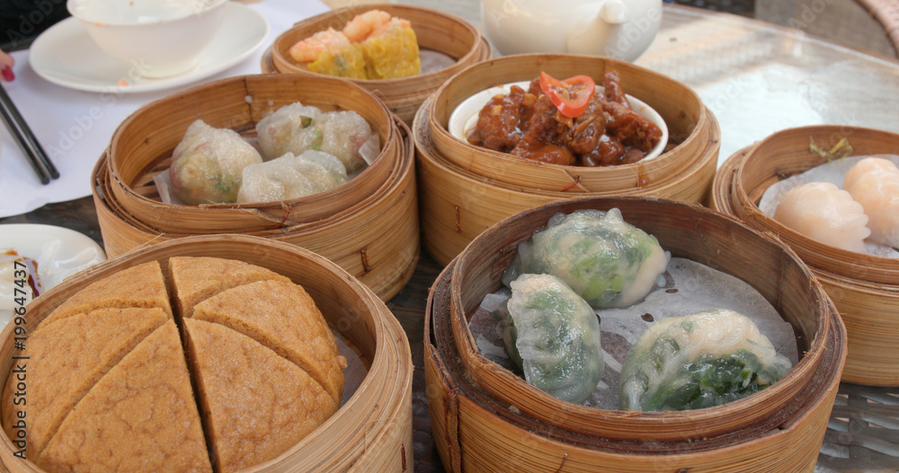 Eating chinese dim sum in restaurant