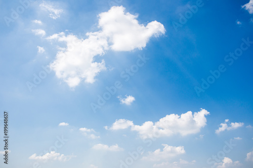 Group of clouds in the blue sky background. © DG PhotoStock
