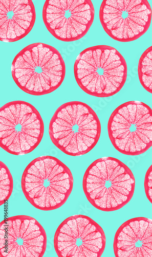 grapefruits slices on bright blue background